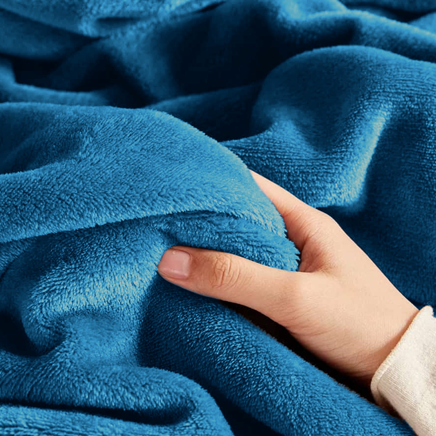 teal throw and blanket
