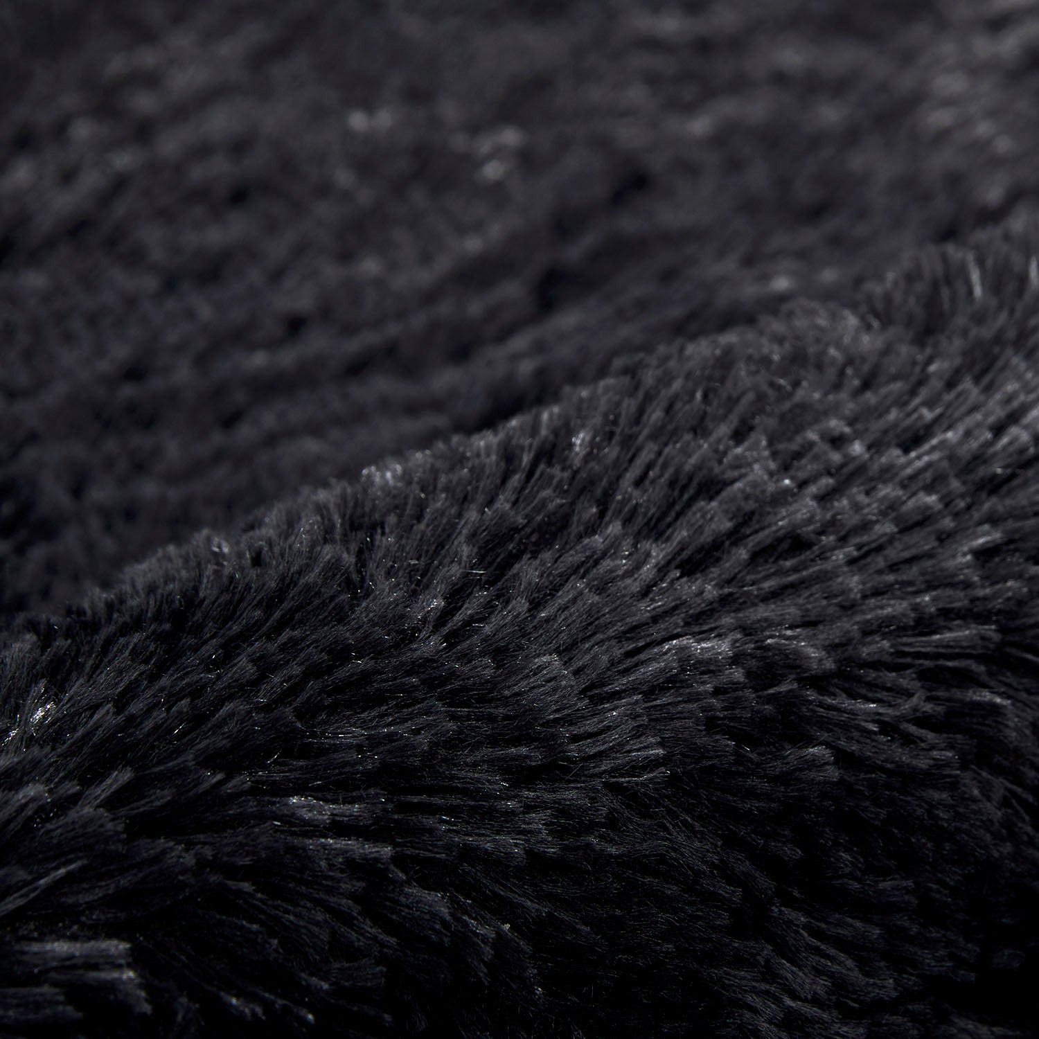 black sheepskin rug